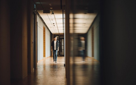 Student walking down a hallway at school
