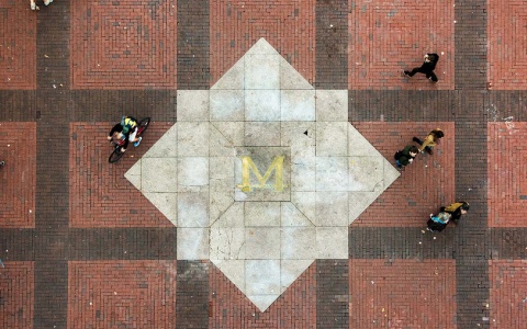 A block M on the ground on University of Michigan's campus